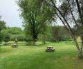 picnic tables by the pond at the marc