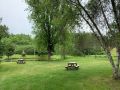 picnic tables by the pond at the marc